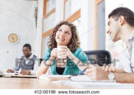 Stock Photo - Business people talking in office. Fotosearch