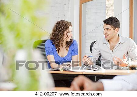 Business people talking in office View Large Photo Image Stock Photo - Business people talking in office. Fotosearch