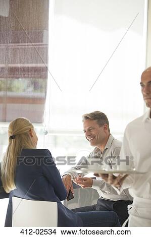 Business people talking in restaurant View Large Photo Image Picture - Business people talking in restaurant. Fotosearch