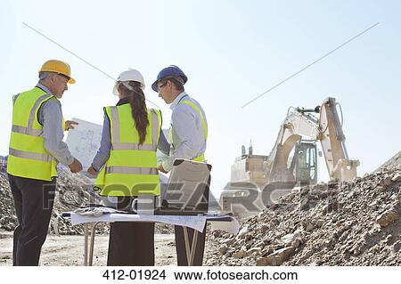 Business people talking on site View Large Photo Image Picture - Business people talking on site. Fotosearch