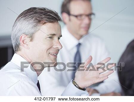 Stock Photo - Businessman talking in meeting. Fotosearch