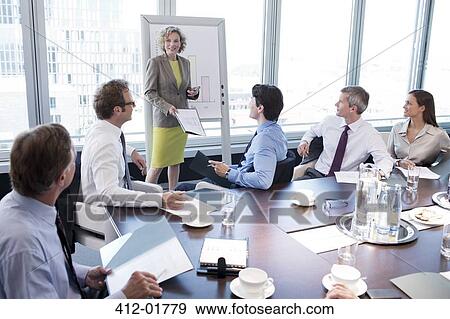 Businesswoman talking in meeting View Large Photo Image Stock Photo - Businesswoman talking in meeting. Fotosearch