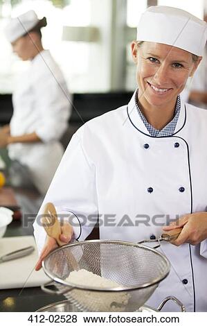 Stock Photo - Chef baking in restaurant kitchen. Fotosearch