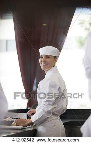 Chef chopping in restaurant kitchen View Large Photo Image Stock Image - Chef chopping in restaurant kitchen. Fotosearch