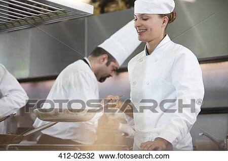 Chef cooking in restaurant kitchen View Large Photo Image Stock Image - Chef cooking in restaurant kitchen. Fotosearch