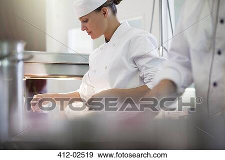 Chef cooking in restaurant kitchen View Large Photo Image Stock Photo - Chef cooking in restaurant kitchen. Fotosearch