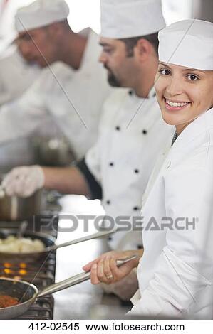 Chefs cooking in restaurant kitchen View Large Photo Image Stock Photography - Chefs cooking in restaurant kitchen. Fotosearch