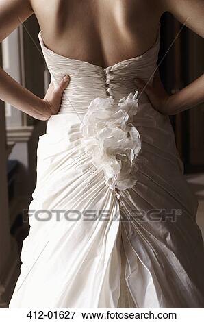 Stock Photo - Close up of bride's gown. Fotosearch