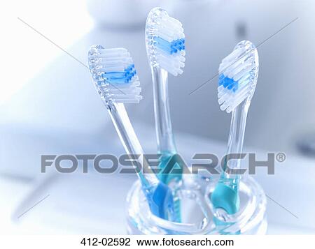 Close up of toothbrushes in holder View Large Photo Image Stock Image - Close up of toothbrushes in holder. Fotosearch