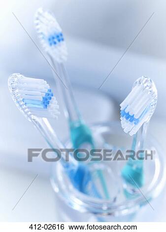 Close up of toothbrushes in holder View Large Photo Image Stock Photograph - Close up of toothbrushes in holder. Fotosearch