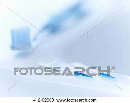 Stock Image - Close up of toothpicks and toothbrush. Fotosearch