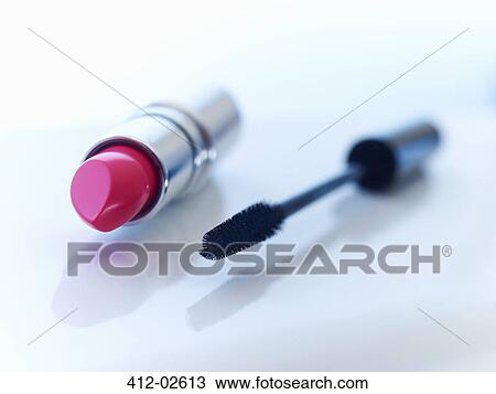 Stock Image - Close up of tube of lipstick and mascara. Fotosearch