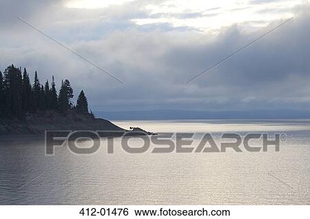 Clouds over rural forest and lake View Large Photo Image Stock Photograph - Clouds over rural forest and lake. Fotosearch