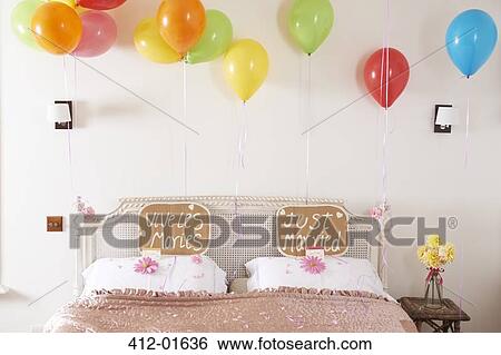 Decorated marriage bed with balloons and signs View Large Photo Image Stock Photograph - Decorated marriage bed with balloons and signs. Fotosearch