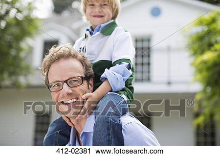 Father carrying son on shoulders outdoors View Large Photo Image Stock Image - Father carrying son on shoulders outdoors. Fotosearch