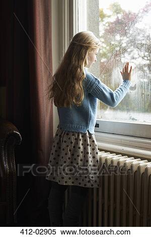 Girl looking out window View Large Photo Image Stock Photography - Girl looking out window. Fotosearch