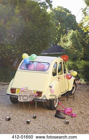 Stock Image - Newlywed's car decorated with balloons. Fotosearch