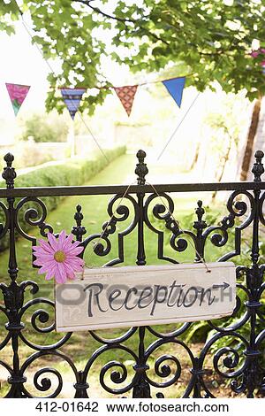 Stock Image - 'Reception' sign on wrought iron fence. Fotosearch