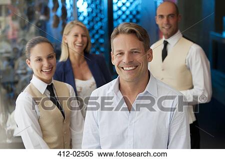 Stock Photography - Restaurant staff smiling together. Fotosearch