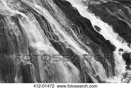 River rushing down rocky falls View Large Photo Image Stock Image - River rushing down rocky falls. Fotosearch