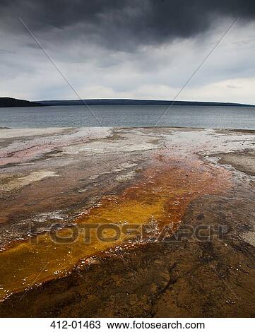 Rock formations under cloudy sky View Large Photo Image Stock Image - Rock formations under cloudy sky. Fotosearch