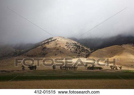Rolling hills in rural landscape View Large Photo Image Stock Photography - Rolling hills in rural landscape. Fotosearch