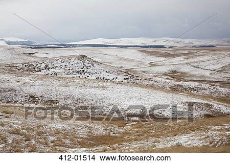 Rolling hills in snowy landscape View Large Photo Image Picture - Rolling hills in snowy landscape. Fotosearch