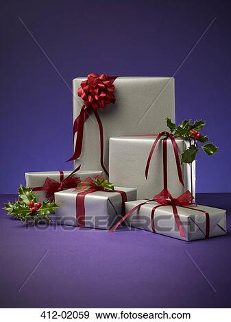 Stack of wrapped Christmas presents View Large Photo Image Stock Photo - Stack of wrapped Christmas presents. Fotosearch