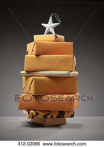 Stack of wrapped Christmas presents View Large Photo Image Stock Photograph - Stack of wrapped Christmas presents. Fotosearch