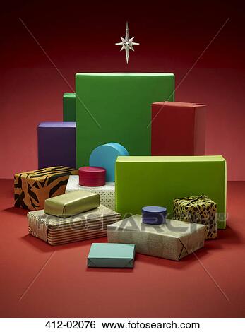 Stack of wrapped Christmas presents View Large Photo Image Stock Photograph - Stack of wrapped Christmas presents. Fotosearch