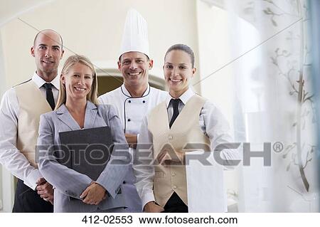 Staff smiling in restaurant View Large Photo Image Stock Image - Staff smiling in restaurant. Fotosearch
