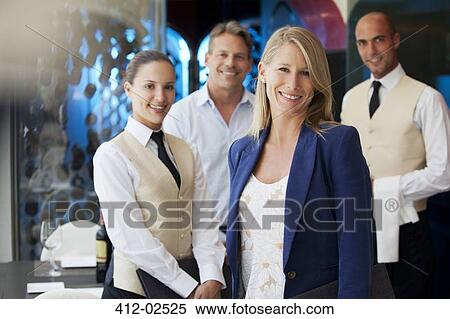 Staff smiling in restaurant View Large Photo Image Stock Photography - Staff smiling in restaurant. Fotosearch