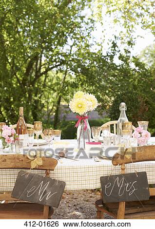 Table setting for outdoor wedding reception View Large Photo Image Stock Photograph - Table setting for outdoor wedding reception. Fotosearch