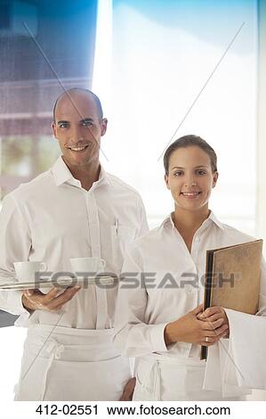 Wait staff smiling in restaurant View Large Photo Image Stock Image - Wait staff smiling in restaurant. Fotosearch