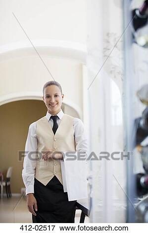 Waitress smiling in restaurant View Large Photo Image Stock Photo - Waitress smiling in restaurant. Fotosearch