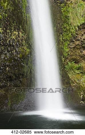 Stock Photography - Waterfall emptying into still pool. Fotosearch