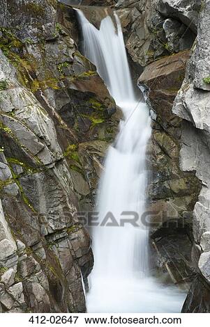 Stock Photo - Waterfall on rocky hillside. Fotosearch