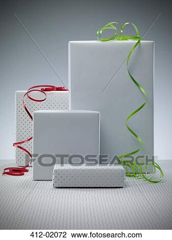 Wrapped presents with ribbons View Large Photo Image Stock Image - Wrapped presents with ribbons. Fotosearch