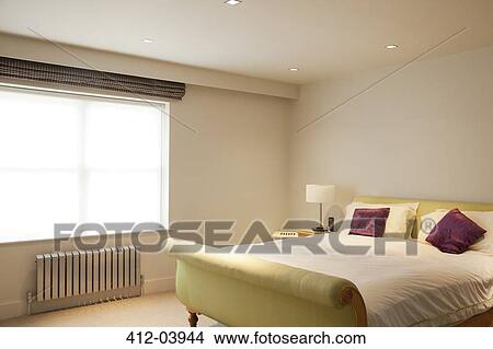 Bed and radiator in modern bedroom View Large Photo Image Picture - Bed and radiator in modern bedroom. Fotosearch