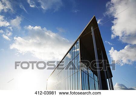 Blue sky reflected in modern building View Large Photo Image Stock Image - Blue sky reflected in modern building. Fotosearch