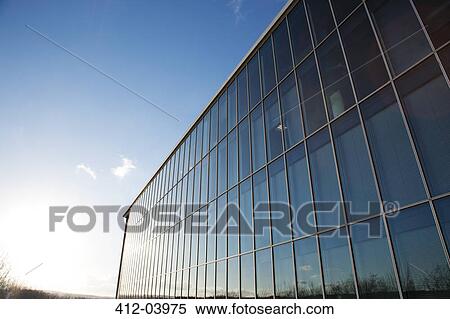 Blue sky reflected in modern building View Large Photo Image Stock Photography - Blue sky reflected in modern building. Fotosearch