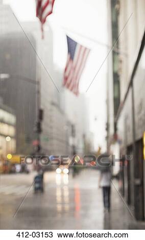 Blurred view of American flags on city street View Large Photo Image Stock Image - Blurred view of American flags on city street. Fotosearch