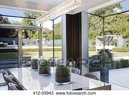 Centerpieces on table in modern dining room View Large Photo Image Stock Image - Centerpieces on table in modern dining room. Fotosearch