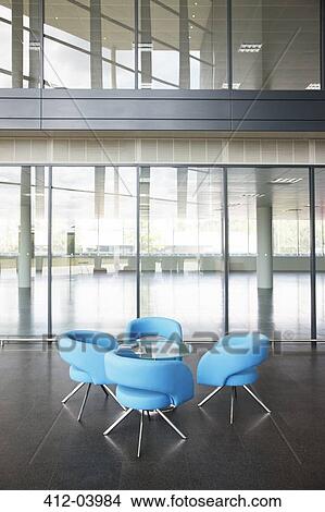 Chairs and table in office lobby area View Large Photo Image Picture - Chairs and table in office lobby area. Fotosearch