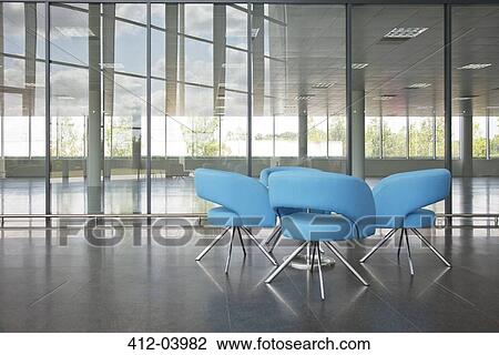 Chairs and table in office lobby area View Large Photo Image Stock Image - Chairs and table in office lobby area. Fotosearch