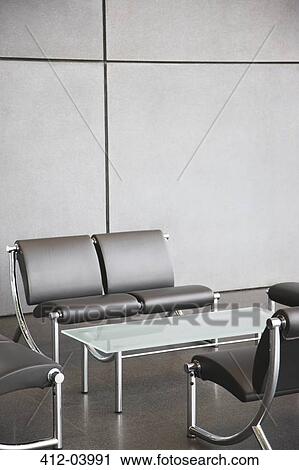 Chairs and table in office lobby area View Large Photo Image Stock Image - Chairs and table in office lobby area. Fotosearch