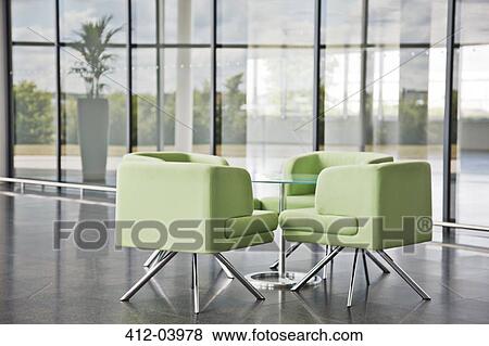 Chairs and table in office lobby area View Large Photo Image Stock Photo - Chairs and table in office lobby area. Fotosearch