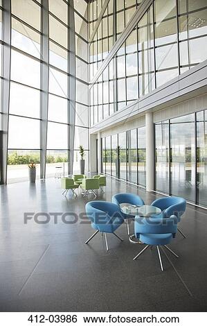 Chairs and table in office lobby area View Large Photo Image Stock Photograph - Chairs and table in office lobby area. Fotosearch