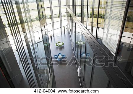 Picture - Chairs and tables in office lobby area. Fotosearch