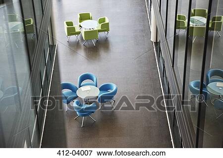 Stock Photo - Chairs and tables in office lobby area. Fotosearch